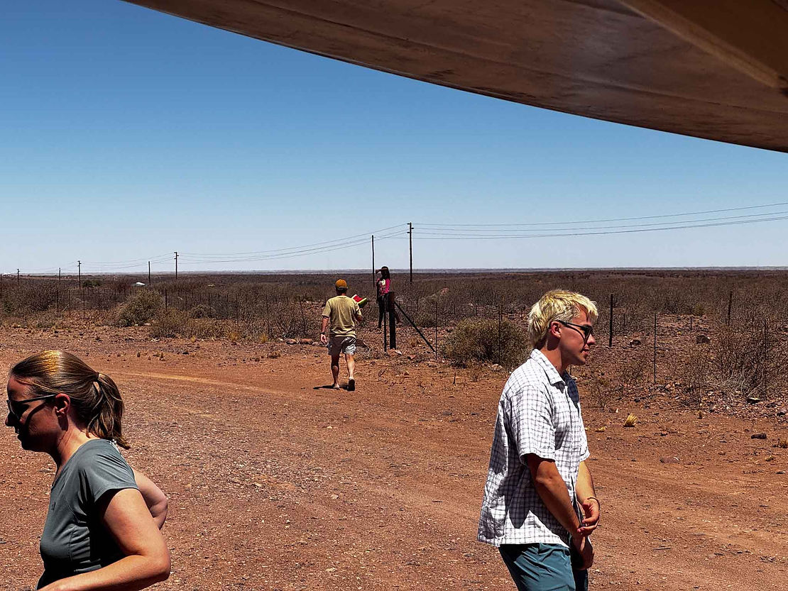 As we were wrapping up the boy on the fence (perhaps 5?) appeared out of nowhere. He might have come from a small tin shack we could see about a quarter mile away. We sent him back with lunch, which he seemed pleased with. He wore no shoes, despite walking across scorching hot sharp rocks.