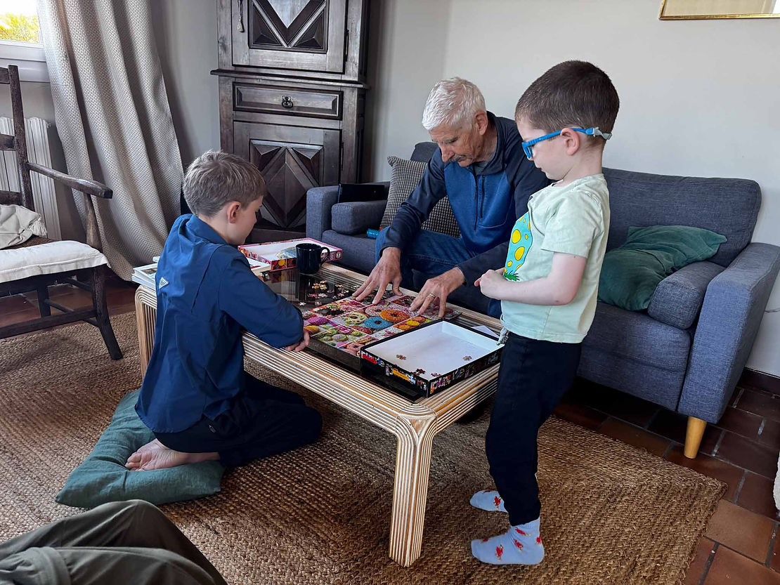 "helping" Grandpa with a puzzle