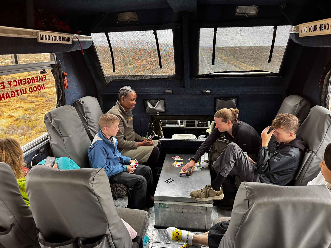 Playing cards in the truck with Tembe - cook extrodionare