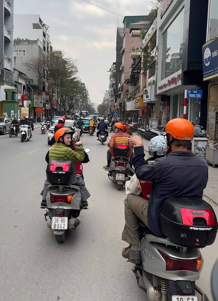 We took a motorcycle-based food tour in Hanoi, where we all made our best attempt to eat snails.
