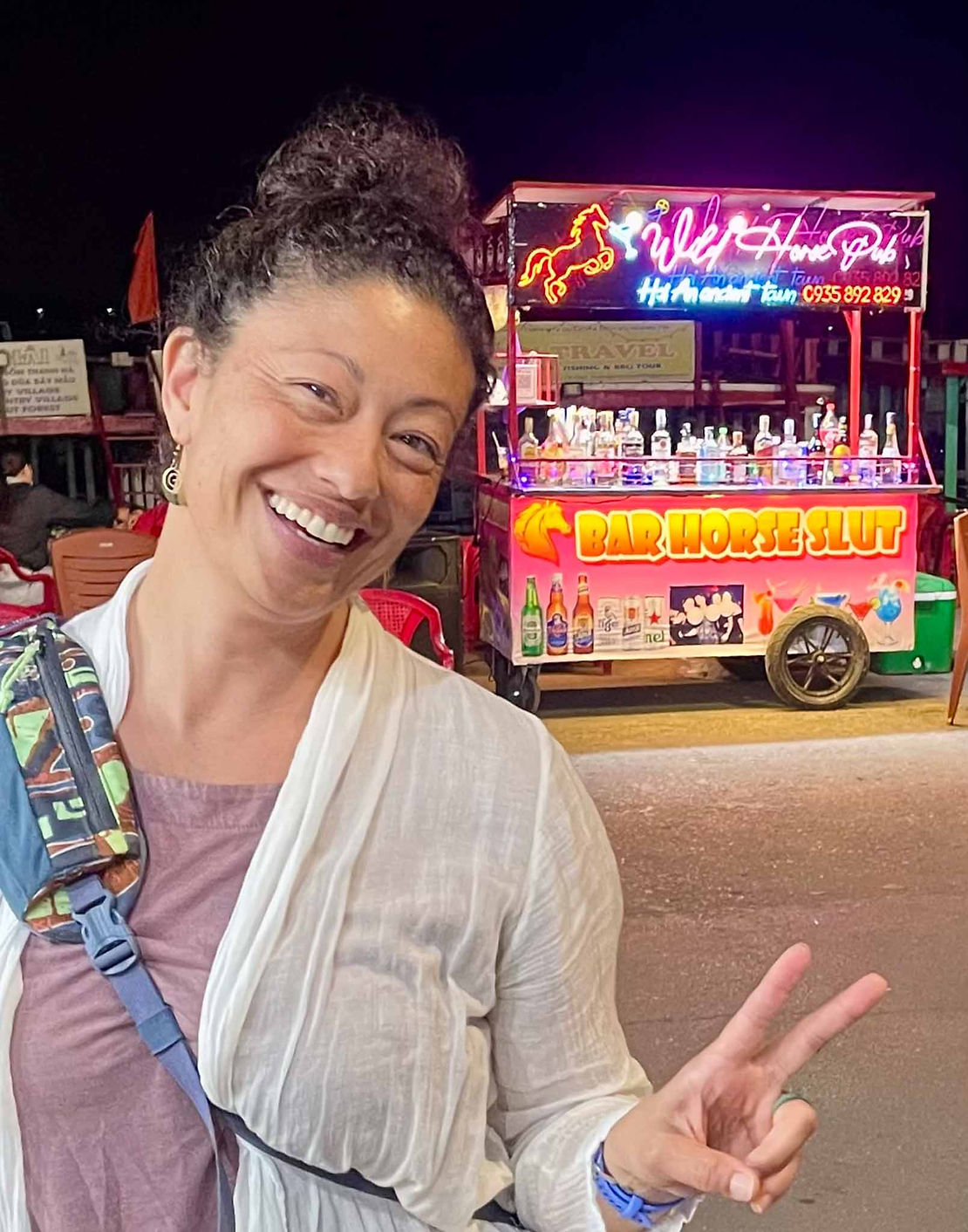 Alanna enjoys the (we hope) mis-translations at the night market.
