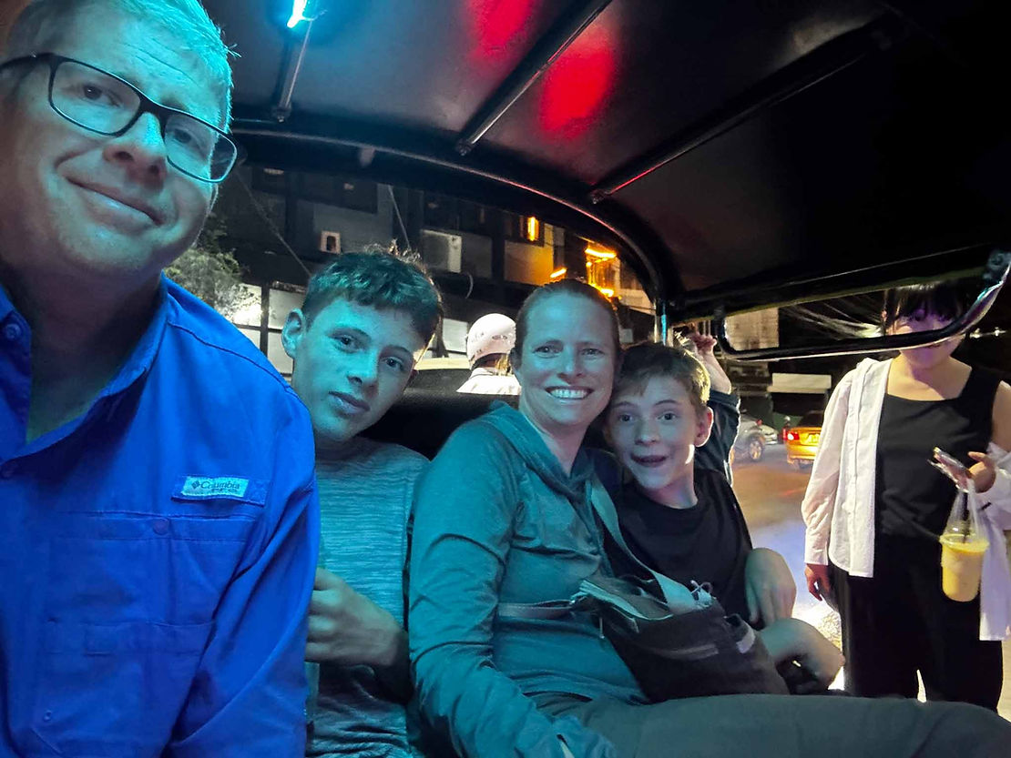 Squeezing into a Tuk-Tuk (three wheeled motorcycle taxi)